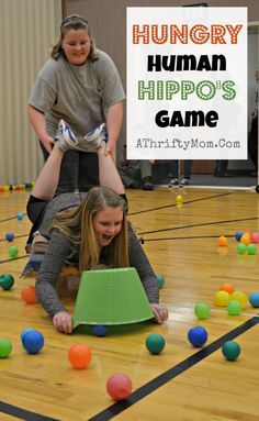 two girls are playing with balls on the floor