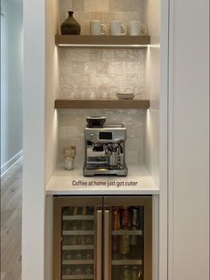 the coffee bar is built into the corner of the kitchen cabinet, and has an automatic coffee maker on top