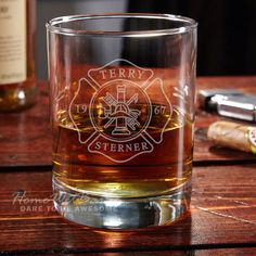 a shot glass sitting on top of a wooden table