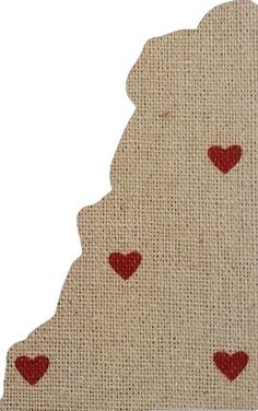 a piece of burlap with red hearts on it and the shape of a map