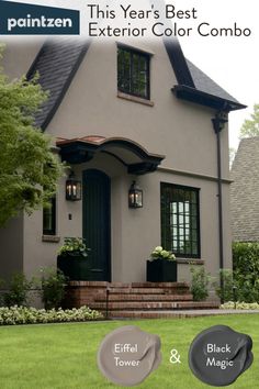 a gray house with black shutters and green doors on the front steps is shown