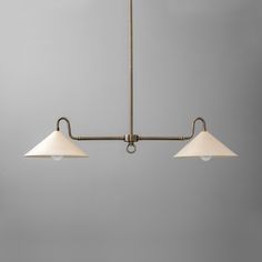 three light brass chandelier with white shades