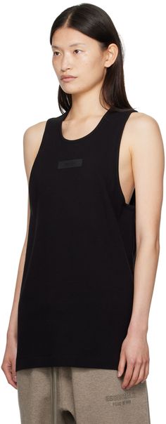 Stretch cotton ribbed jersey tank top. · Scoop neck · Rubberized logo patch at chest Part of the Core Collection. Supplier color: Black Black Cotton Scoop Neck Vest, Black Cotton Racerback Muscle Tee, Rib Tank Top, Fear Of God Essentials, Jersey Tank Top, Fear Of God, Ribbed Tank Tops, Black Rib, Black Tank Tops