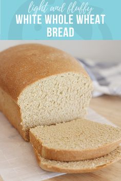 a loaf of white whole wheat bread sitting on top of a cutting board with the words, light and fluffy white whole wheat bread