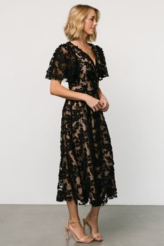 Gorgeous midi for formal occasions Black tulle material over nude lining Floral embroidery throughout V-neckline Paneled waistband Hidden zipper at back for closure Fully lined, excluding sleeves Self and Lining: 100% Polyester Trina is 5'6, cup size 32D, size 2 and is wearing size S