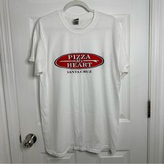 Pizza My Heart T-Shirt. From Santa Cruz, California. Unisex. Size L. Pit To Pit: 22” Across Length: 30” Sleeves: 7” Condition: Nwot White Crew Neck Shirt With Heart Graphic, White Christmas T-shirt With Text Print, White Short Sleeve Shirt With Heart Graphic, Pizza My Heart, Santa Cruz Shirt, Heart Tshirt, Santa Cruz California, Heart T Shirt, Hannah Montana