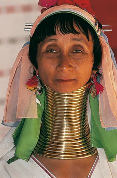 a woman with a large neck piece on her head