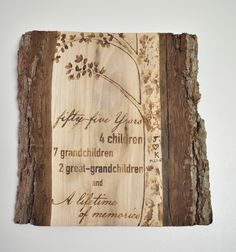 a piece of wood with writing on it