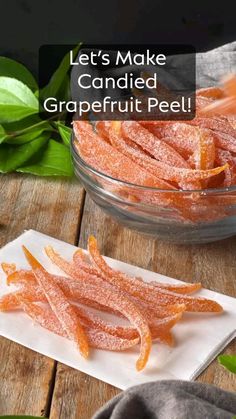 candied grapefruit peels in a glass bowl on a wooden table with leaves