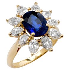 This beautiful sapphire and diamond ring was manufactured by Asprey of London, Jewelers to the Queen. The ring features an oval cut blue sapphire with an approximate weight of 2.30 carats surrounded by 10 pear shape diamonds with an approximate total weight of 1.75 carats, averaging H color and VS2 clarity. Signed A & Co. Original box included. Ring Size is 5 1/2 Metal Type: 18 Karat Yellow Gold Aventurine Ring, European Cut Diamond Ring, Retro Bracelet, Platinum Diamond Rings, Sapphire And Diamond Ring, Diamond Cocktail Rings, Bezel Set Diamond, European Cut Diamonds, Blue Sapphire Rings