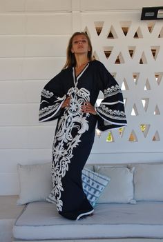 "A flashy extremely vibrant and unique caftan that will make you feel like true royalty. This white embroidered caftan with its unique flared sleeves and vibrant embroidery throughout is a a true stunner! It is an extremely comfortable wear, light and soft and can be used on many occasions - home gatherings, festival parties, summer occasions, dinners, or just in your home to feel comfortable. -----------Medium------------ Bust : 39-40 Hip : 45-46 -----------Large---------------- Bust : 44-45 Hi Summer V-neck Embroidered Abaya, Summer Embroidered V-neck Abaya, Elegant Embroidered Kaftan For Vacation, Embroidered Long Sleeve Kaftan For Beach Cover-up, Spring Beach Embroidered Abaya, Floor-length Embroidered Kaftan For Spring, Blue Caftan, Embroidered Caftan, Embroidered Kaftan