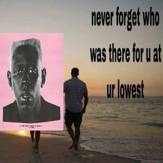 a man is walking on the beach with a pink poster in front of him that says, never forget who was there for us at ur lowest