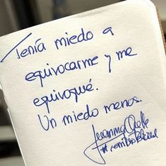 a piece of paper that has writing on it with blue ink in spanish and english