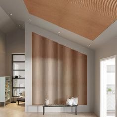 an empty room with wooden slats on the wall and wood flooring in it