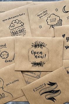 several envelopes with hand drawn designs on them