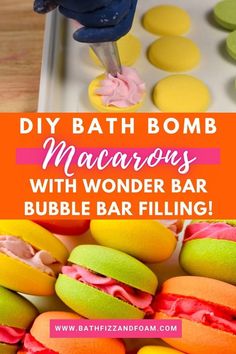 some macaroons are being made with fondant and sprinkles to make them