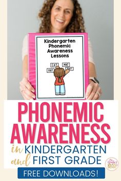 a girl holding up a pink book with the words phonicic awareness in it