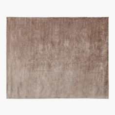 a brown rug on a white background with no one in the room to see it