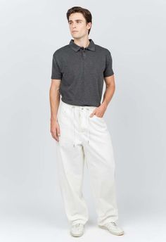 One size. fits xs-xl  color: white  adjustable waist  lightweight fabric  baggy fit  100% cotton  dry clean  by the nkc store    product measurements:  waist: 86.36cm / 34in  inseam: 66cm / 26in    model is 185cm / 6’1” wearing size o/s Designer Clothes For Men, Something Went Wrong, Baggy Fits, Work Pants, Mens Trousers, Lightweight Fabric, Color White, Dry Clean, Trousers