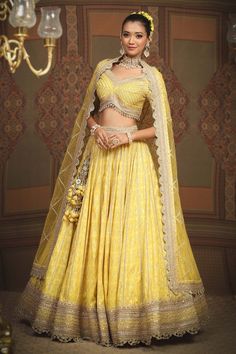 Lemon yellow cotton shimmer chanderi lehenga with attached cancan, geometric patterns, intricate gota, dori and badla work and broad border. Comes with padded, gota work blouse and lace border net dupatta. - Aza Fashions Fitted Gold Lehenga With Chikankari Embroidery, Traditional Yellow Lehenga With Chikankari Embroidery, Yellow Chikankari Embroidered Sharara For Reception, Yellow Chikankari Embroidery Sharara For Reception, Festive Yellow Choli With Chikankari Embroidery, Designer Yellow Lehenga With Chikankari Embroidery, Gold Lehenga With Chikankari Embroidery For Reception, Yellow Fitted Choli With Resham Embroidery, Yellow Anarkali Set With Chikankari Embroidery For Reception