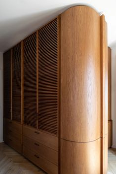 a large wooden cabinet sitting in the corner of a room