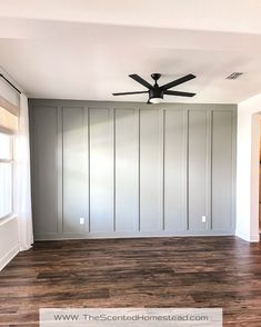 empty room with ceiling fan and wood floor