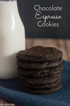 chocolate espresso cookies are stacked next to a glass of milk