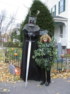 two people dressed in costumes standing next to each other