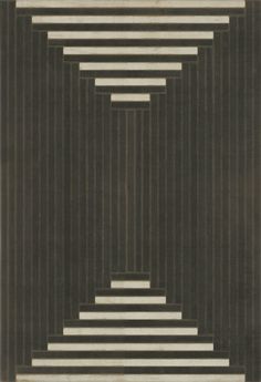 an abstract black and white rug with vertical lines in the center, on a gray background