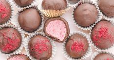 there are many chocolates with pink frosting on them