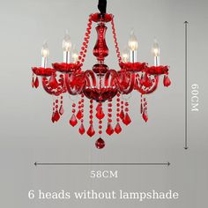 a red chandelier hanging from the ceiling with six lights and beaded beads