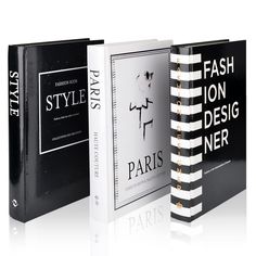 three black and white books with the title paris style fashion design never written on them