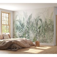 a room with a bed, window and painting on the wall behind it that is covered in leaves