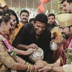 the bride and groom are getting ready to exchange their wedding rings at this hindu ceremony