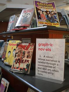 there are many books on the shelves in this store, including graphic novels and comics