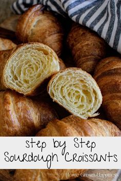 some croissants sitting on top of a cutting board with the words step by step sourdough croissants