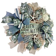 a wreath made out of burlocks and ribbons with words written on the front