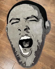 an image of a man's face on the floor with his mouth wide open