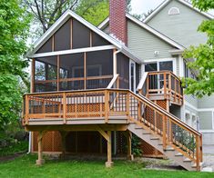 a house with a deck and stairs leading up to it