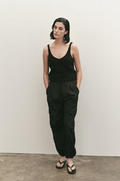 FINAL SALE Please note that this is a Final Sale item. No returns or exchanges will be accepted. Lightweight Cargo Pants in Black designed by Mijeong Park. Drawstring at elasticated waistband and elasticated cuffs. Cargo pocket at out-seams and front side pockets. Sizing + Details → Made In South Korea 88% Viscose, 12% Nylon Hand Wash Unlined Model Stands 5' 9" And Wears S XS — Waist 25", Length 39", Hip 32", Inseam 28", Rise 14" S — Waist 26.5", Length 39.5", Hip 34", Inseam 28.5", Rise 14" M — Black Parachute Pants For Loungewear With Elastic Waistband, Black Parachute Pants For Loungewear, Workwear Black Cargo Pants With Elastic Waistband, Black Cargo Pants With Elastic Waistband For Work, Black Elastic Waistband Cargo Pants For Work, Black Tapered Leg Cargo Pants With Elastic Waistband, Black Cargo Pants With Elastic Waistband And Tapered Leg, Black Parachute Pants With Elastic Waistband And Tapered Leg, Chic Black Parachute Pants With Elastic Waistband