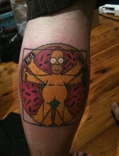 a person with a tattoo on their leg that has a donut in the shape of a cartoon character