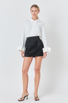 Upgrade your wardrobe with our Satin Pintucked Mini Skirt. This stunning piece features a mini length that shows off your legs while the luxurious satin fabric adds a touch of elegance to your look. The tight fit ensures a flattering silhouette and the pintuck details add texture and dimension. Plus the lining provides added comfort and coverage. Pair it with a blouse for a sophisticated ensemble or a crop top for a fun and flirty vibe. Embrace style and comfort with our Satin Pintucked Mini Skirt. Perfect for any occasion. Mini length Satin Tight fit Lining Hand wash cold Do not bleach Do not tumble dry Iron low Shell: 100% Polyester Lining: 100% Polyester Contrast: 95% Polyester 5% Spandex HN3084K Total length: 15.25" Waist: 27.5" S BLACK: Height 5'9" Bust 32" Waist 23" Hips 34" Knitwear Trends, Knit Loungewear, Strapless Bodycon Dress, Denim Sweater, Blouse Pants, Tweed Dress, Leather Dresses, 5 S, Lace White Dress