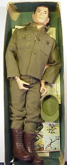 a toy soldier is in a box with other items on the floor and inside it