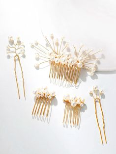 Beautiful and elegant, these delicate hand-wired bridal or prom style hair pins and decorative hair combs are adorn with various sized pearls. The gold tone finish wires are easy to adjust according to your most desired hair style. Sold as a set of 5 hair pieces.DETAILS:Hand wired with pearls of various sizes.Sold as a set of 5 PC (1 x Large Comb, 2 x Small Comb, 2 x Hair Pins)DIMENSIONS: Large Comb is about 4.0"L x 2.4"W MATERIALS: Metal wire, faux pearls Pearl Bridesmaid Jewelry, Decorative Hair Combs, Beach Jewelry Boho, Bridal Jewelry Necklace, Pearl Hair Combs, Comb Set, Bridesmaid Pearls, Wedding Gold, Prom Style