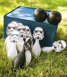 star wars bowling balls and darts in the grass with stormtroopers on them