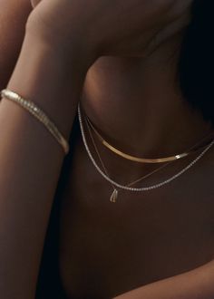 This classic tennis necklace features 2mm natural round diamonds four-prong set in 14k gold. Make a statement and wear Diana without anything else.This piece is made to order. Please allow at least 10-15 business days for production. This piece is only eligible for exchange or store credit. 14k solid gold—always Weight: 14.5g Width: 2.18mm Carat weight: 6.20ctw Diamond color: G Diamond clarity: VS2 SI1 Box clasp with safety Tennis Necklace Diamond, Stacked Wedding Rings, Diamond Tennis Necklace, Herringbone Chain, Herringbone Necklace, Necklace Diamond, Classy Jewelry, Box Clasp, Tennis Necklace