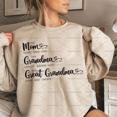 a woman wearing a sweatshirt with the words grandma and great grandma printed on her back