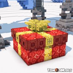 a red and yellow box sitting on top of a snow covered ground