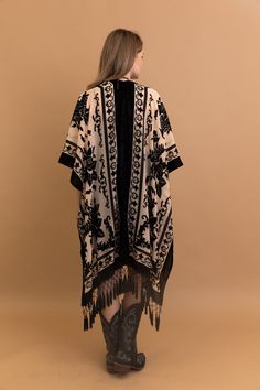 Indulge in elegance with our Velvet Dream Mesh Tapestry Kimono. Crafted from sumptuous velvet and adorned with intricate tapestry motifs, this kimono exudes luxury and style. Perfect for lounging at home or adding a touch of glamour to any outfit. #lovemyleto 50% Viscose 50% Nylon Imported Traditional Kimono With Tassels, Festival Black Shawl Kimono, Elegant Festival Kimono, Elegant Embroidered Kimono For Festival, Black Bohemian Style Festive Kimono, Festive Bohemian Black Kimono, Festive Black Bohemian Kimono, Velvet Tapestry, Tapestry Print