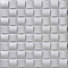 a white wall that has some squares on it